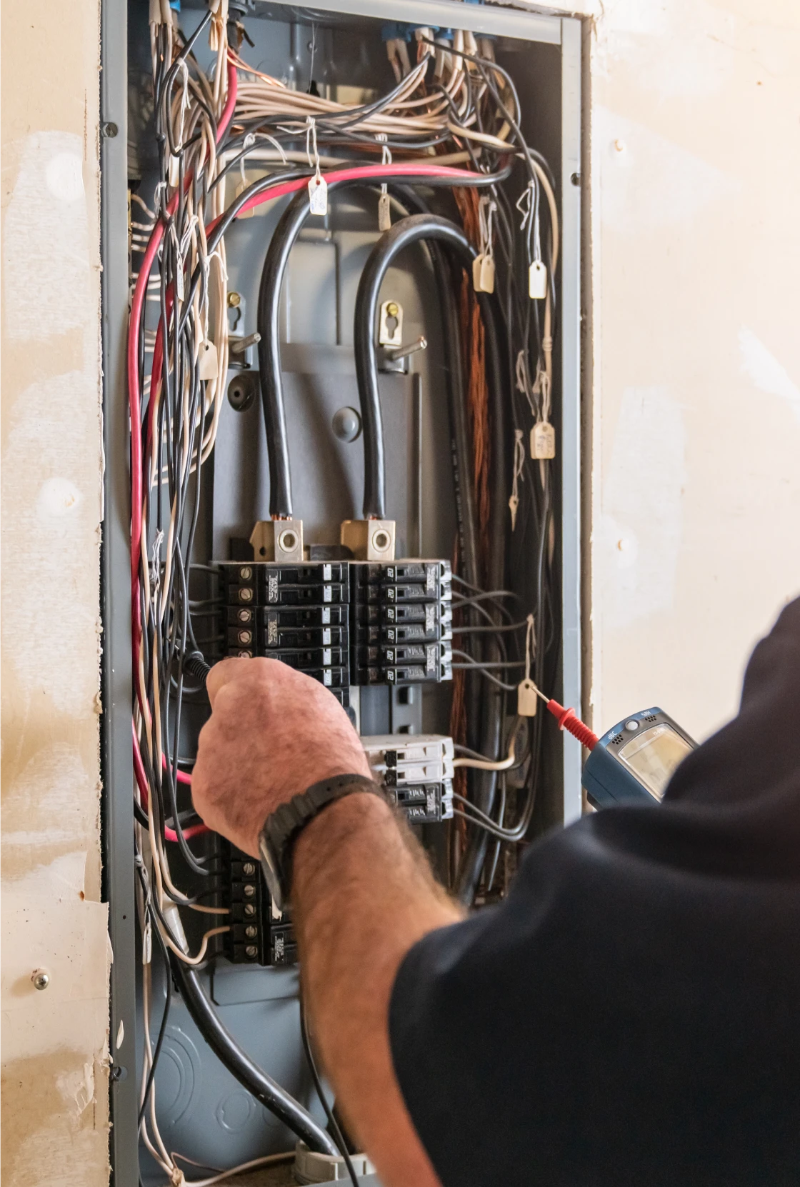 Hand examining electrical box